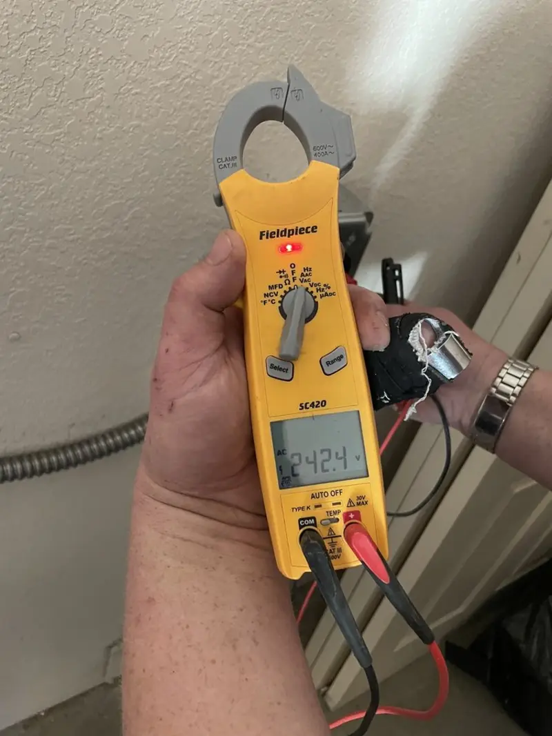 Voltage testing with clamp meter during Outlet Installation in Oak Ridge